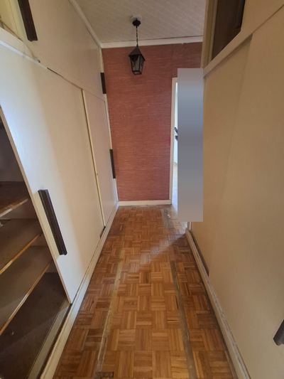 Couloir entièrement dégagé après le débarras du logement
